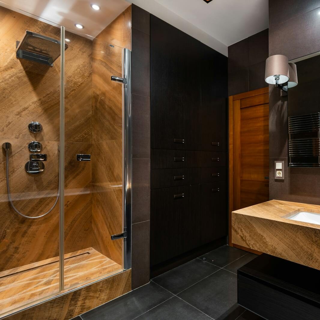 Stunning modern bathroom interior with wooden accents and contemporary fixtures, offering a luxurious and spacious feel.